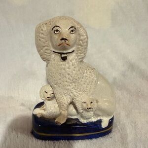 19th-century English Staffordshire pottery figurine of a poodle with two puppies